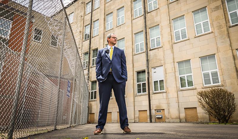 尼克Peitz, standing in front of the Mount Pleasant Correctional Facility building