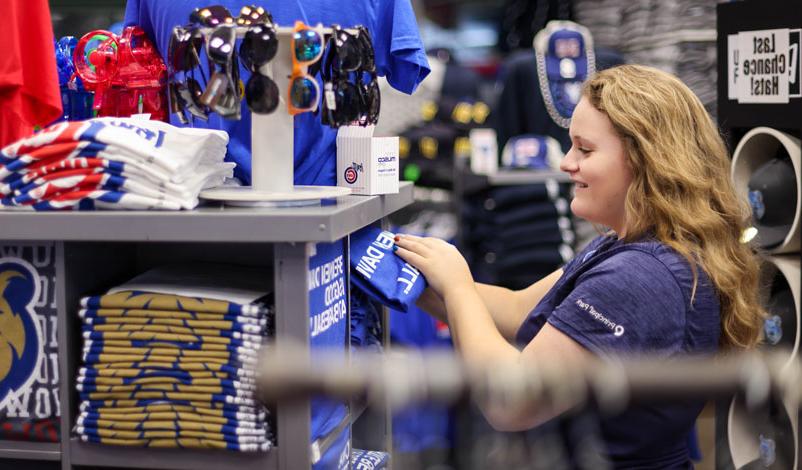Katelyn Kral, sorting merchandise for the Iowa Cubs